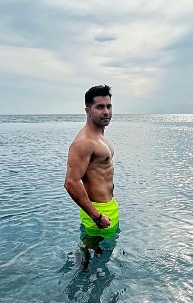 Varun Dhawan, shirtless in a pool, exudes charisma and charm, making Monday blues fade away with his infectious energy and captivating smile
